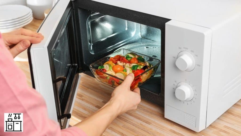 Image of a man keeping food in microwave oven