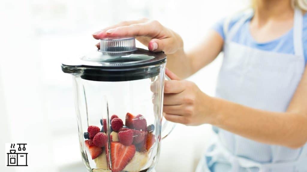 Image of a woman operating a blender