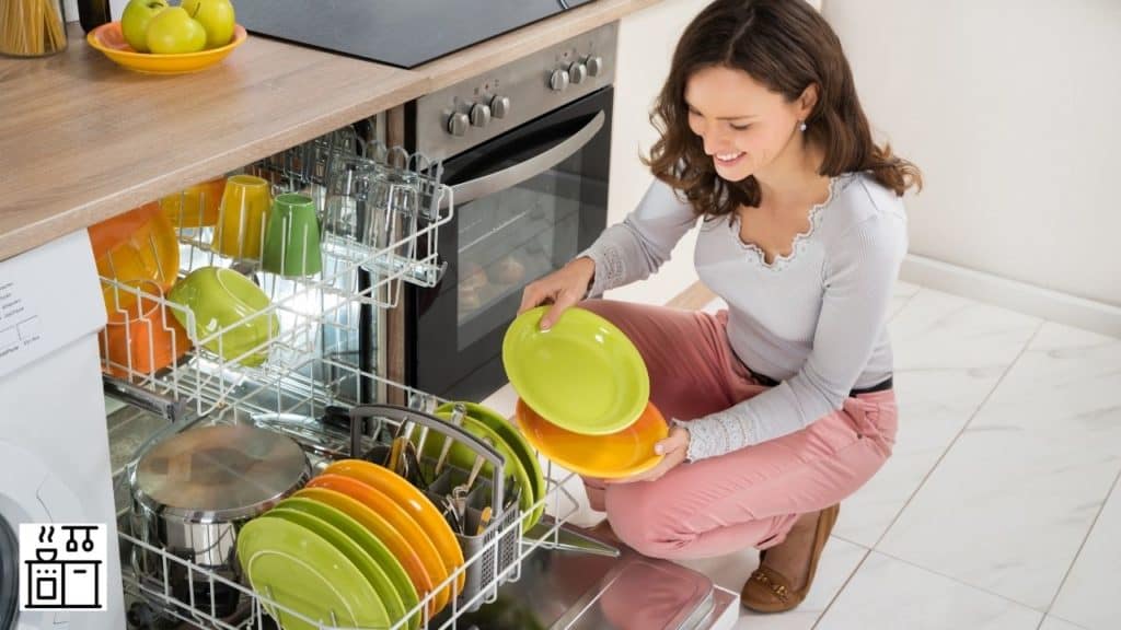 Image of a woman using a dishwasher
