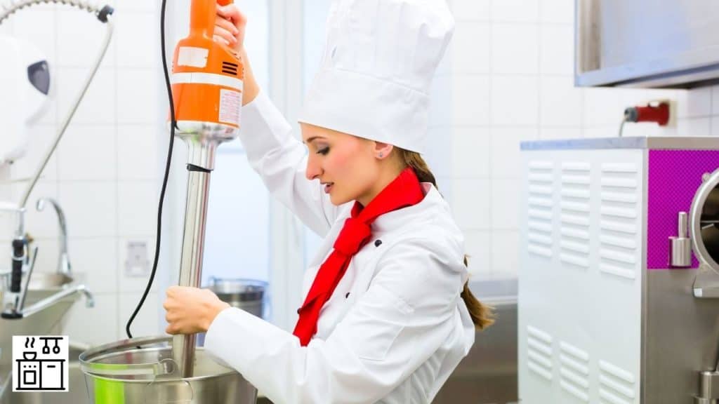 Image of a chef using a food processor