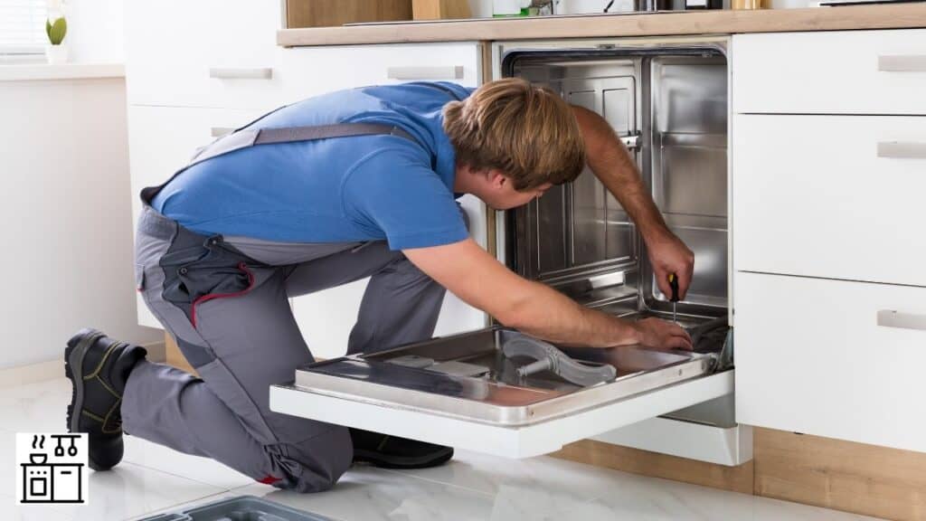 Image of a man installing dishwasher