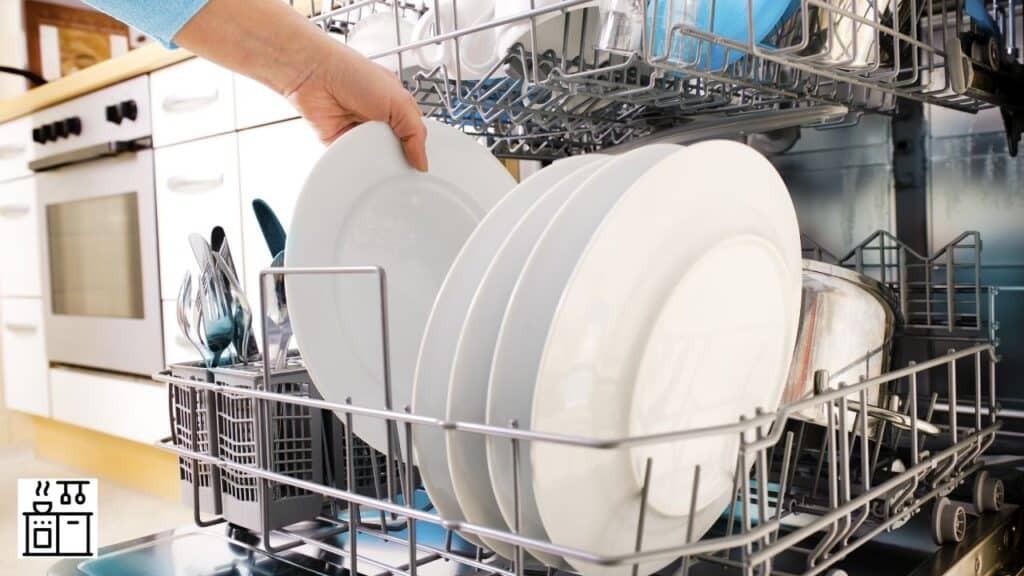 Woman putting dishes in a dishwasher