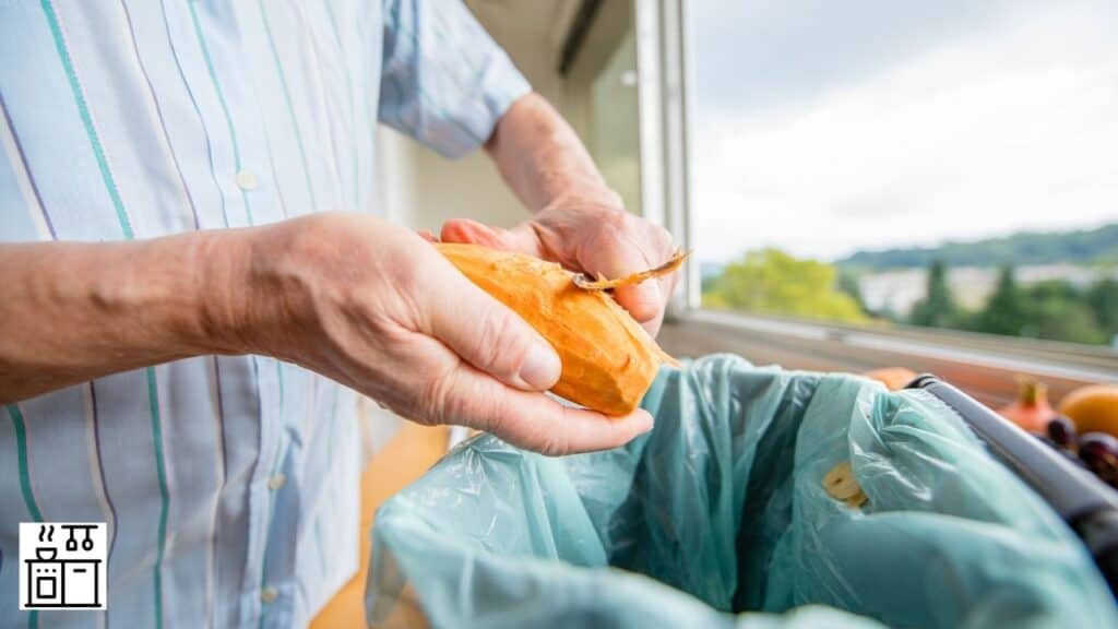 Image of a man peeling sweet potato