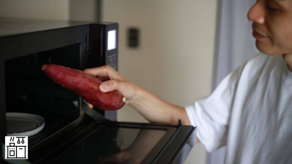 Image of a man placing sweet potato in a microwave