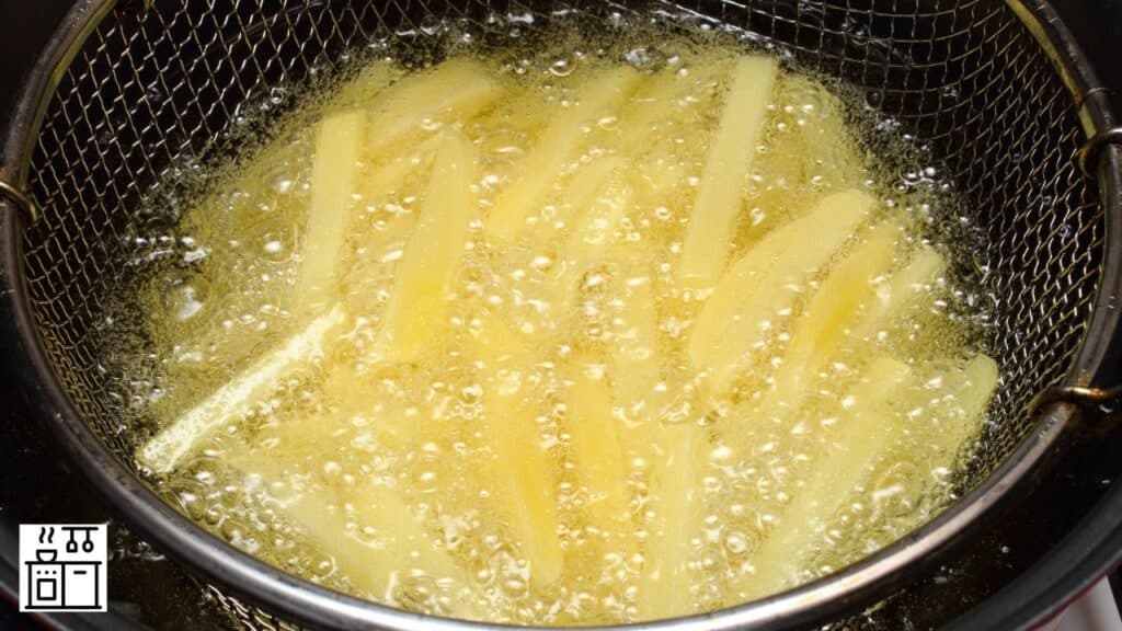 French fries being fried in oil