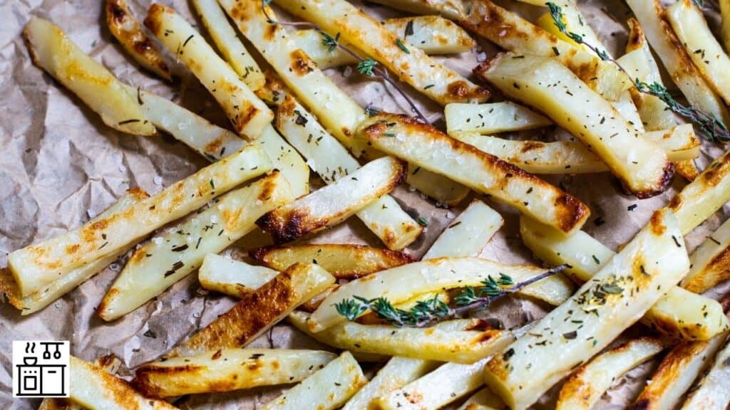 French fries that were baked on parchment paper