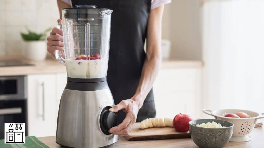 Woman crushing ice in a blender