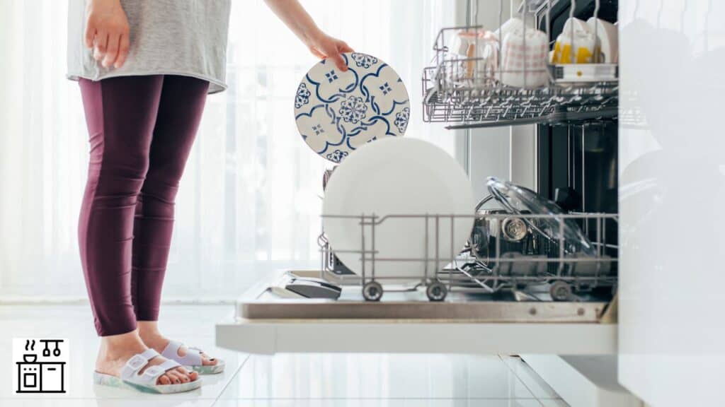 Woman keeping dishes in a durable dishwasher