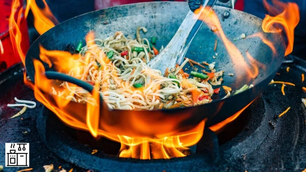 Tossing ingredients in a wok
