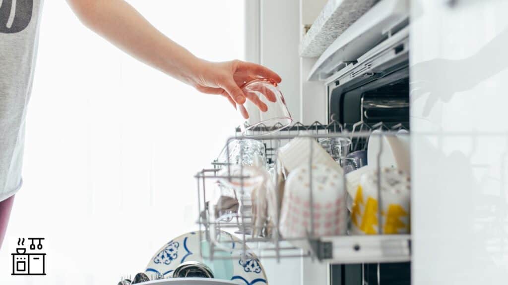 Woman loading a dishwasher
